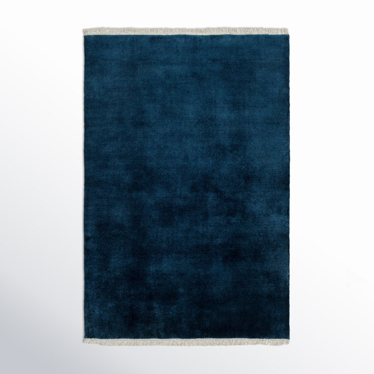 Clio Solid Color Hand Loomed Wool Area Rug in Blue