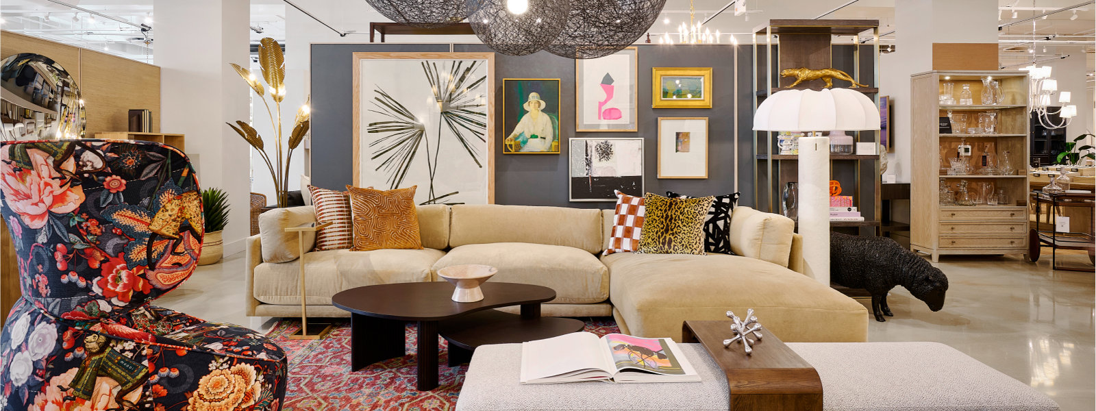 Interior design of a showroom featuring furniture, art, and accessories.