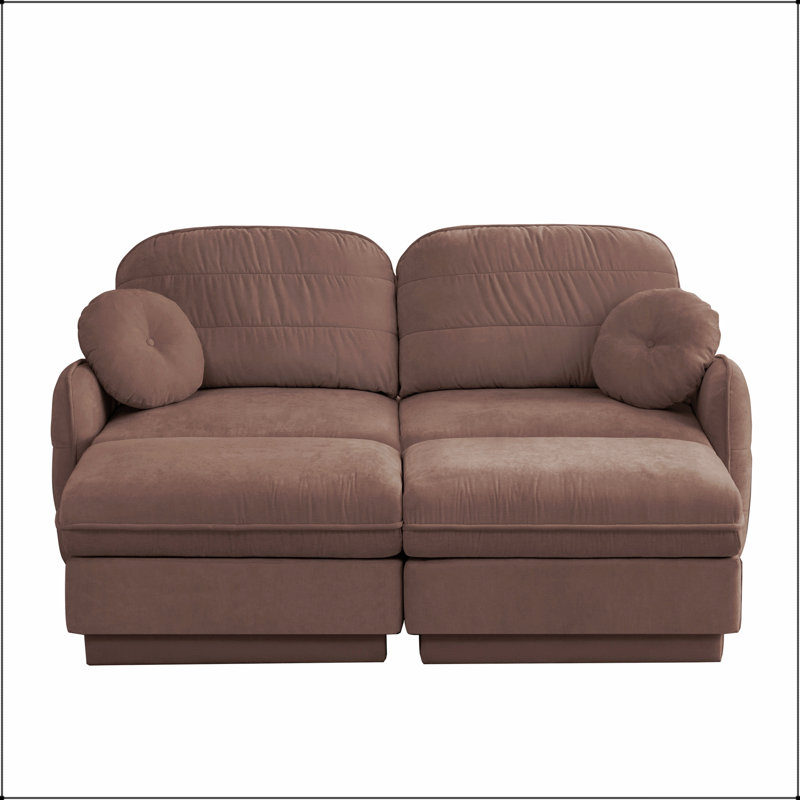 Canapé deux places en forme de U Chenille Cloud avec des assises profondes et des poufs amovibles pour un confort optimal dans un salon moderne.