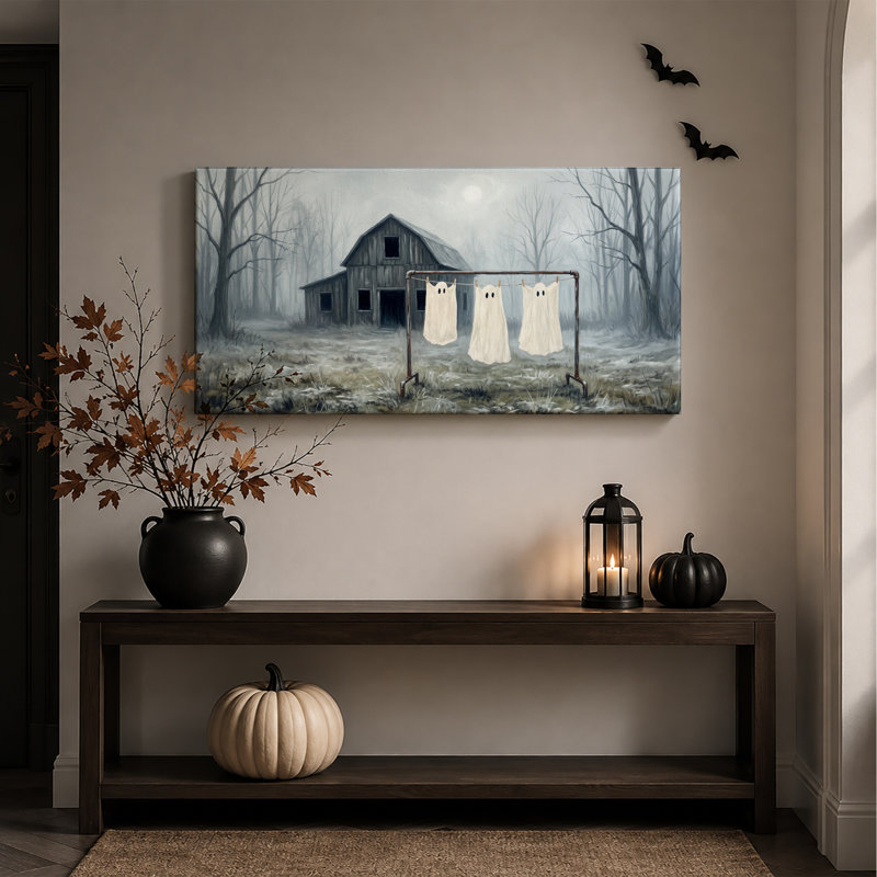 Trois draps fantômes séchant sur une corde à linge devant une toile murale d'Halloween, L 32 po x H 16 po