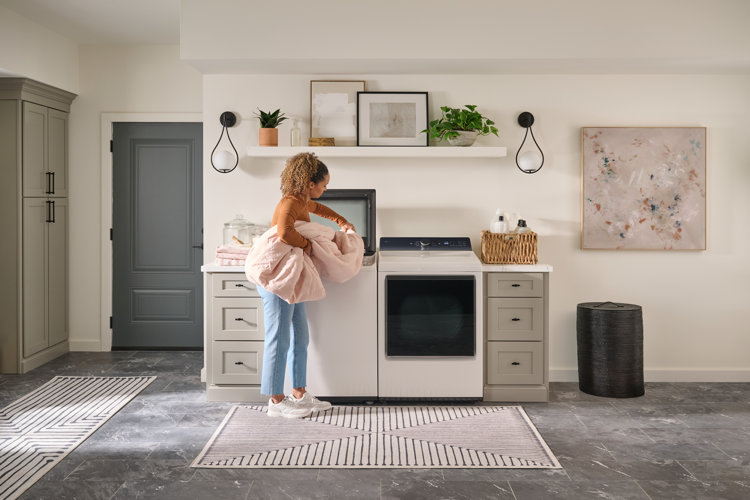 laundry room lighting ideas with two symmetrical pendant lights on either side of the washer dryer setup