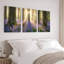Ensemble de 3 tableaux sur toile tendue représentant un lever de soleil en forêt avec des jacinthes des bois et des cerfs-1002414865
