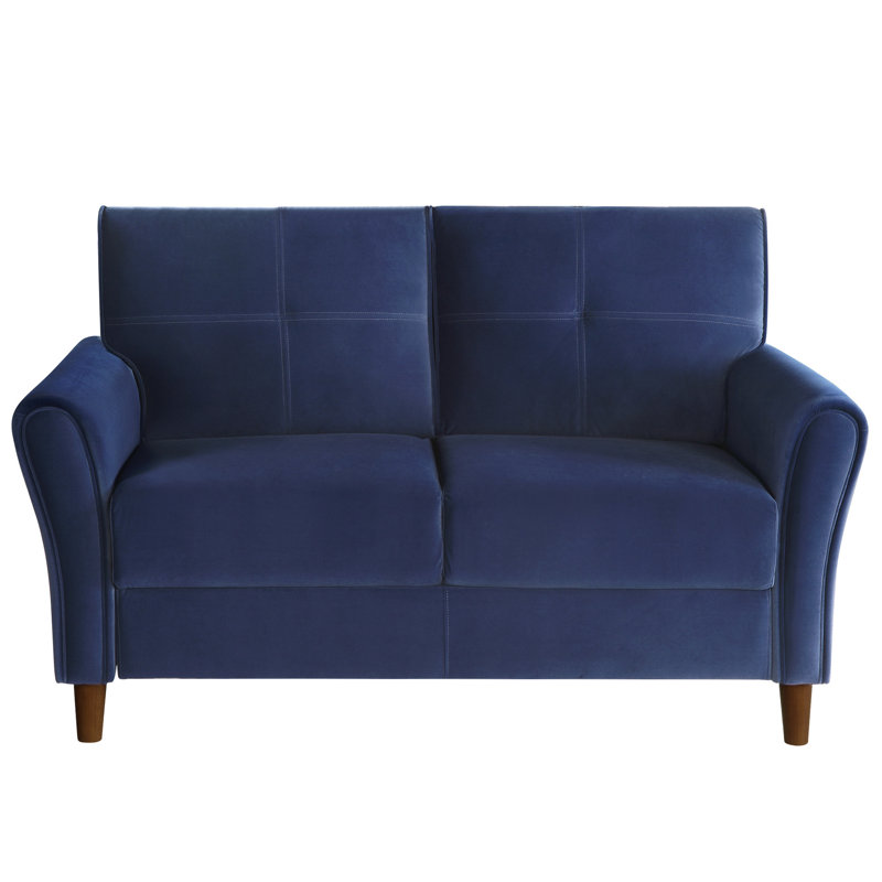 Velours bleu rembourré, mousse haute, pieds en bois apparents et contreplaqué, accoudoirs évasés
