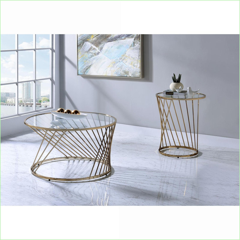 Table basse au fini champagne avec plateau en verre transparent pour le salon, design moderne et élégant