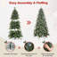 Arbre de Noël artificiel givré avec baies rouges et pomme de pin-290985655