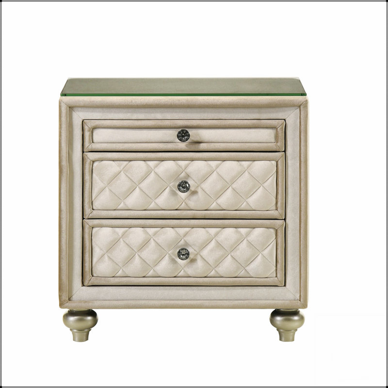 Élégante table de chevet à 2 tiroirs avec un design capitonné et des boutons en cristal, parfaite pour ajouter du luxe à n'importe quelle chambre à coucher.