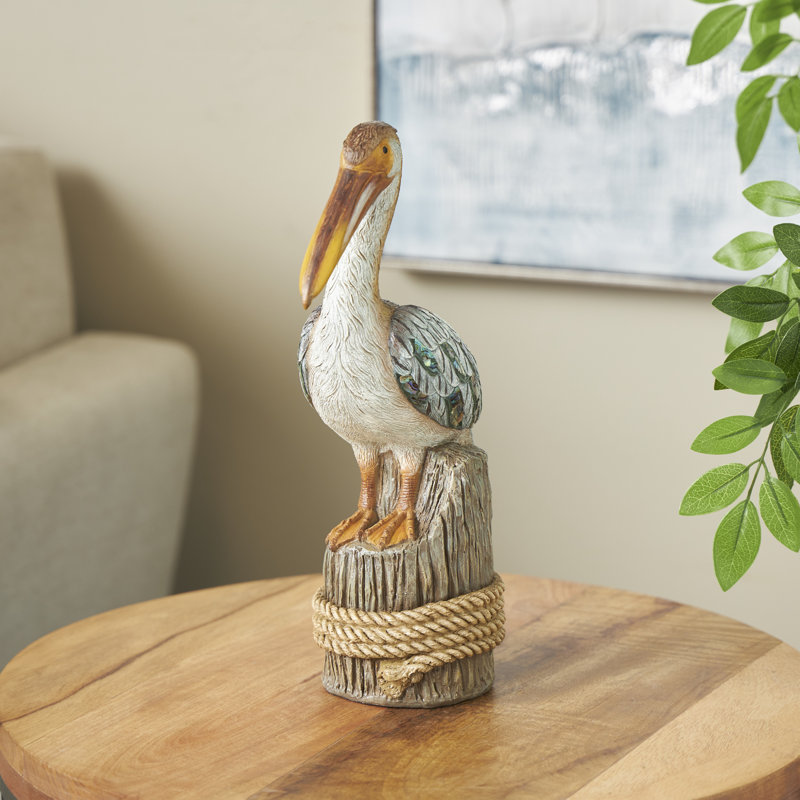 Cole And Grey Resin Textured Pelican Sculpture With Brown Block And Shiny Accents
