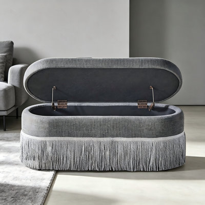 Pouf de rangement ovale capitonné avec franges et couvercle relevable, repose-pieds multifonctionnel et rangement dissimulé pour salon ou chambre - Tissu gris avec structure en métal