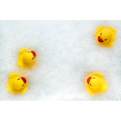 Rubber Ducks In Bath by SolidMaks - Wrapped Canvas Print