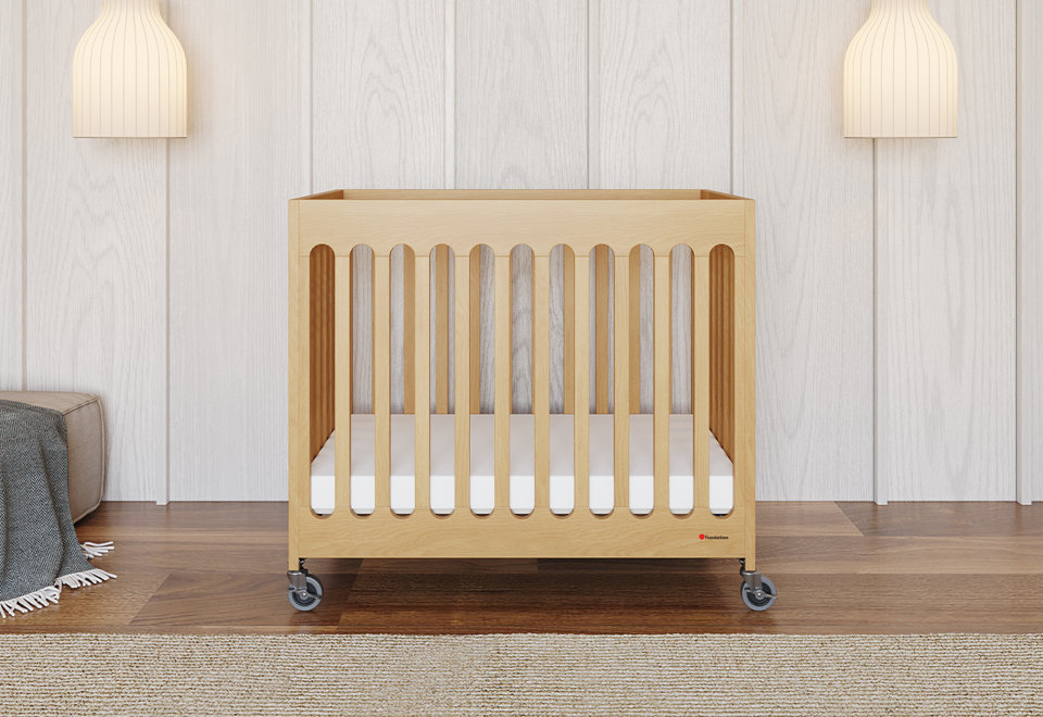 The Modern & Compact Folding Mini Crib