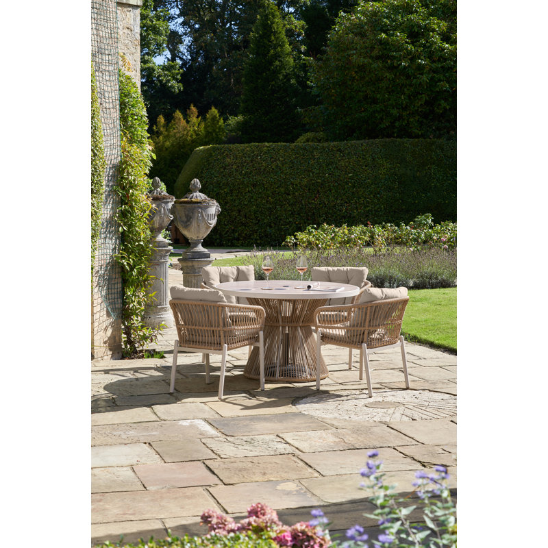 Aris 4 - Person Patio Dining Set with Round Table , Cushions Included