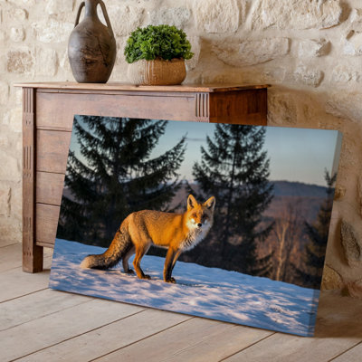 Canvas A Striking Red Fox Stands Confidently In A Snowy Landscape Wall Art Its Vibrant Orange Fur Illuminated By The Soft Golden Light Canvas Wall Art