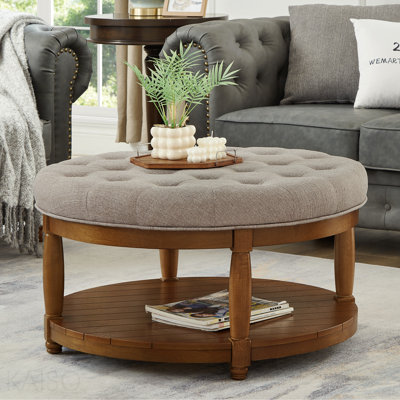 Grande table basse ronde avec repose-pieds capitonnée, rangement en bois - lin