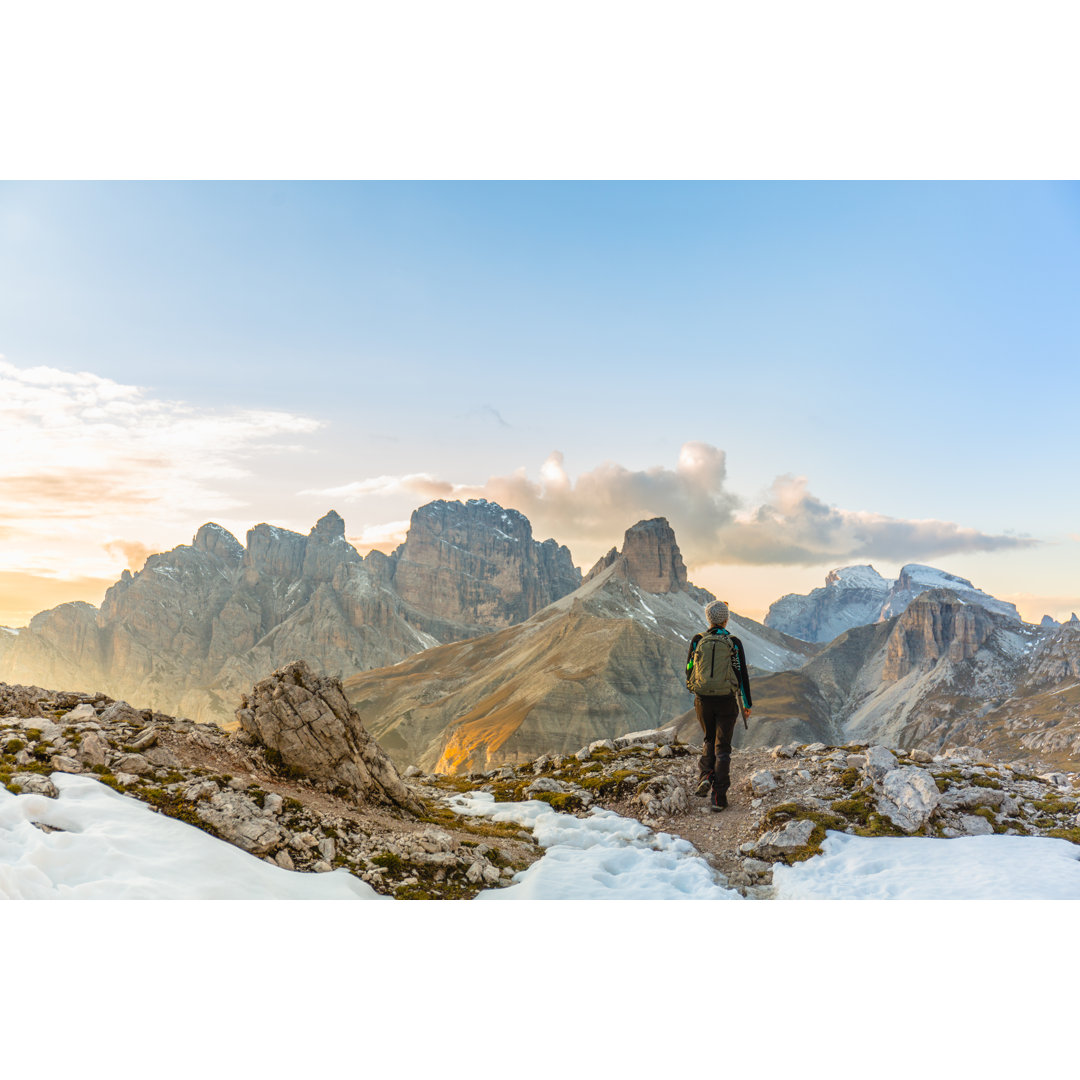 Woman Alone Trekking On The Mountain Path von Deimagine - Druck auf Leinwand ohne Rahmen