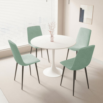 Ensemble de table de salle à manger 31,5 po en MDF rond pour 4 personnes, table de salle à manger blanche en MDF facile à nettoyer avec des pieds en métal noir durable, une chaise de salle à manger confortable en lin 4 pièces pour le restaurant, les réceptions des invités