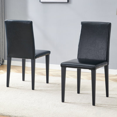 Deux chaises de salle à manger en polyuréthane noir, simples et polyvalentes, confortables et accompagnées. La chaise de salle à manger exquise et multifonctionnelle a ouvert une nouvelle expérience confortable. (Ensemble 2 pièces)
