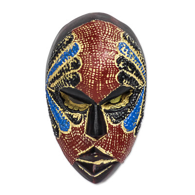Visage de bonheur et masque mural en bois africain