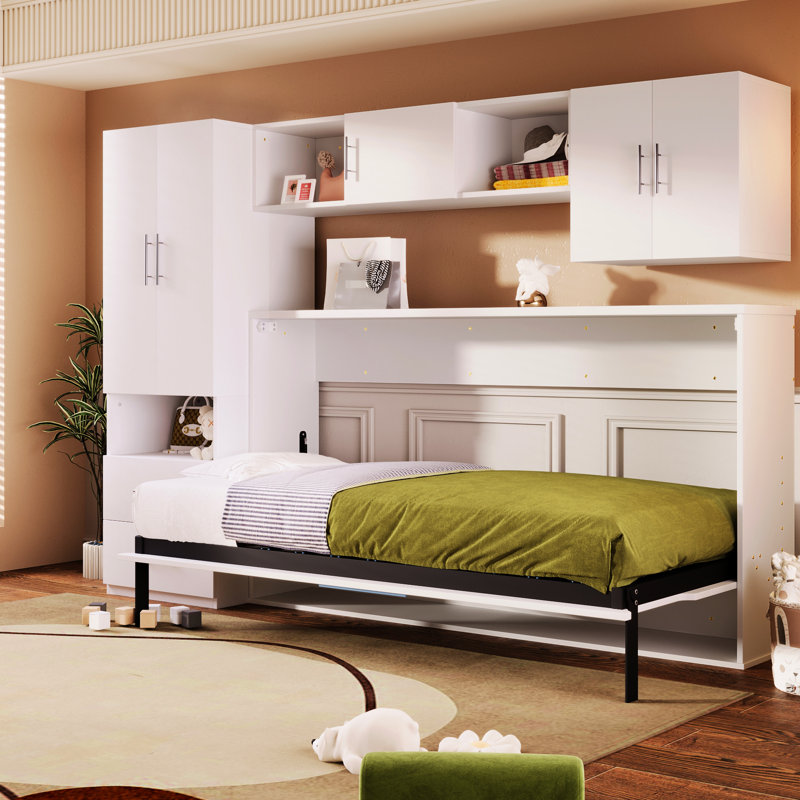 Lit simple blanc avec tablettes ouvertes et tiroirs, garde-robe et table encastrés