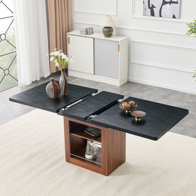 Une table de salle à manger extensible avec espace de rangement et une table de salle à manger extensible de 59 à 71 pouces. Table rectangulaire noire avec cadre en panneau de fibres à densité moyenne de couleur noyer pouvant accueillir 4 à 8 personnes.