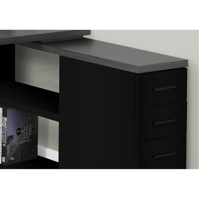 Bureau d'ordinateur moderne en forme de L, noir et gris, avec rangement, plateau en stratifié gris, tiroirs et design fonctionnel.