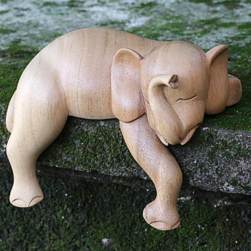 Figurine éléphant faisant la sieste
