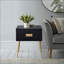 Table basse compacte noire et dorée avec 2 tiroirs, gain de place pour les petits espaces