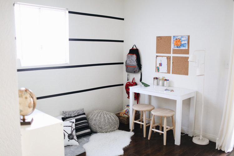 A white bedroom with pink accents