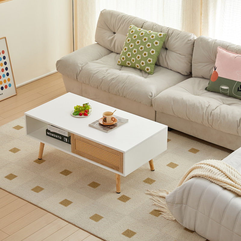 Table de salon blanche avec porte coulissante et pieds en bois massif pour une décoration moderne