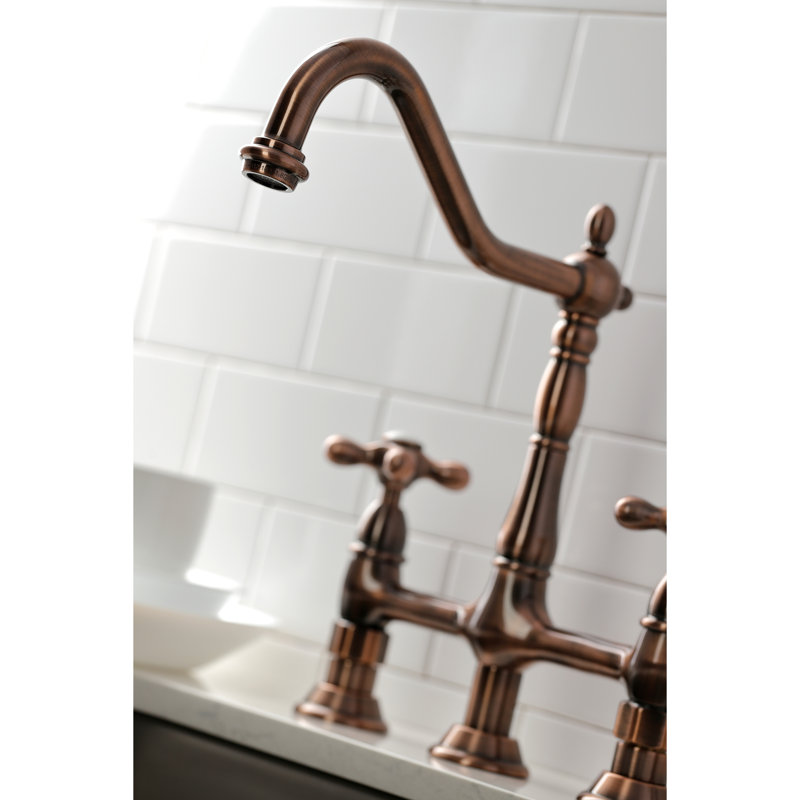 Kingston Brass Heritage Two-Handle 4-Hole Deck Mount Bridge Kitchen Faucet with Brass Side Sprayer, Antique Copper