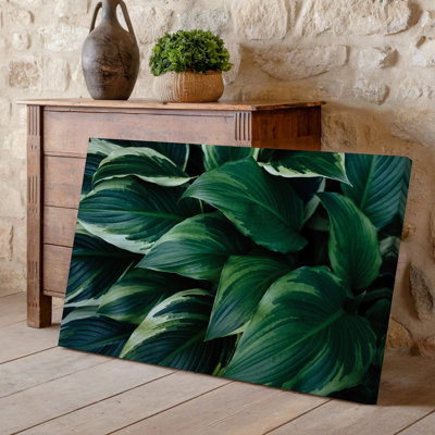 Toile une composition de feuilles vertes luxuriantes chevauchant chaque art mural mettant en vedette une variété de formes et de tailles avec un art mural sur toile
