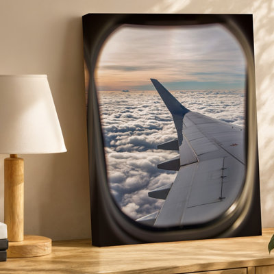 Toile Une vue aérienne sereine d'une fenêtre d'avion mettant en vedette un art mural