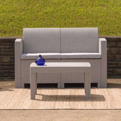 Alderman Faux Rattan Loveseat with All-Weather Cushions by Beachcrest Home