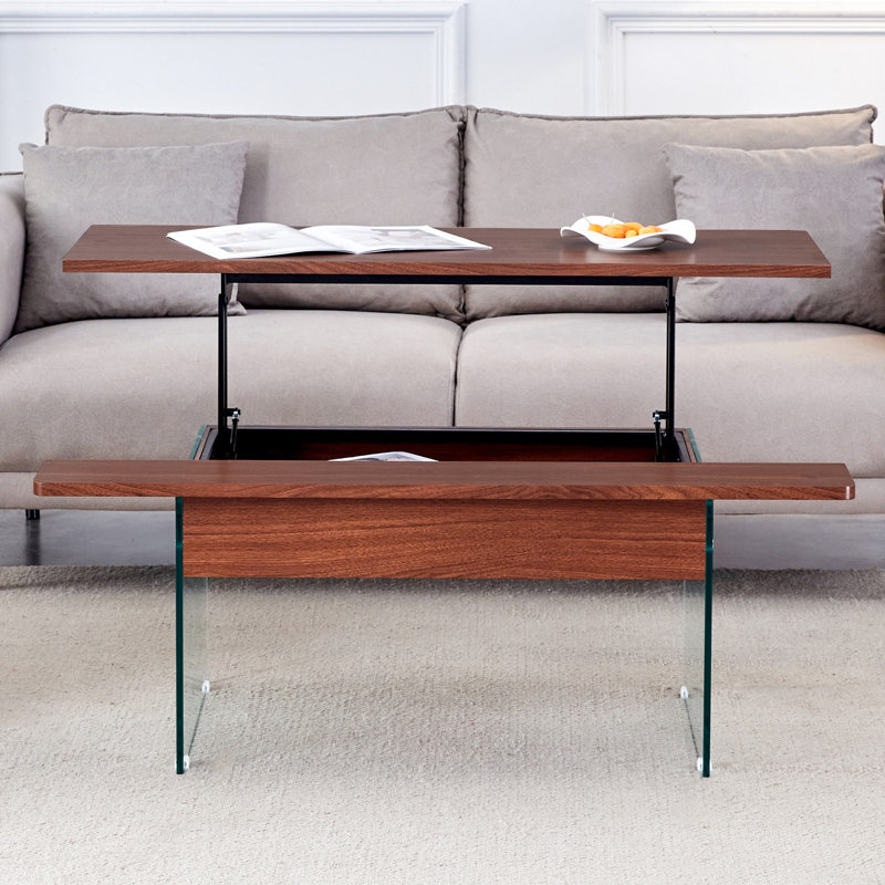 Table basse à plateau relevable avec finition grain de bois foncé et structure de pieds stable, pieds en verre trempé, solution de rangement utile