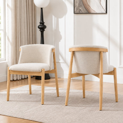 Chaise de salle à manger beige rembourrée de style milieu du siècle, avec revêtement en lin et dossier incurvé