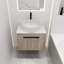 Meuble-lavabo moderne en chêne blanc. Fixation murale 24 po avec cuve en céramique. Porte à fermeture en douceur pour un évier de rangement tentant et spacieux. Espace