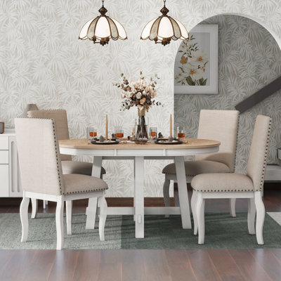 5-Piece Farmhouse Dining Table Set with Extendable Round Wood Table and 4 Upholstered Chairs, Perfect for Cozy Gatherings and Family Meals.