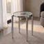 Table d'appoint ronde chromée avec pieds extérieurs fuselés