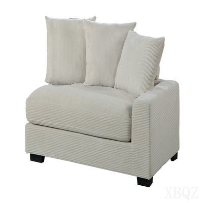 Fauteuil en velours côtelé beige avec coussins et pieds en bois