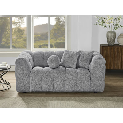 Causeuse 2 places revêtue de tissu bouclé confortable