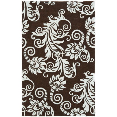 Tapis brun / bleu en laine touffeté à la main à motif floral Llenifer