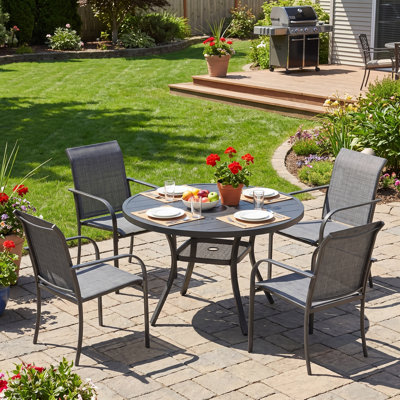  4-Person Patio Dining Set with Round Patio Dining Table and Stackable Armrest Dining Chairs