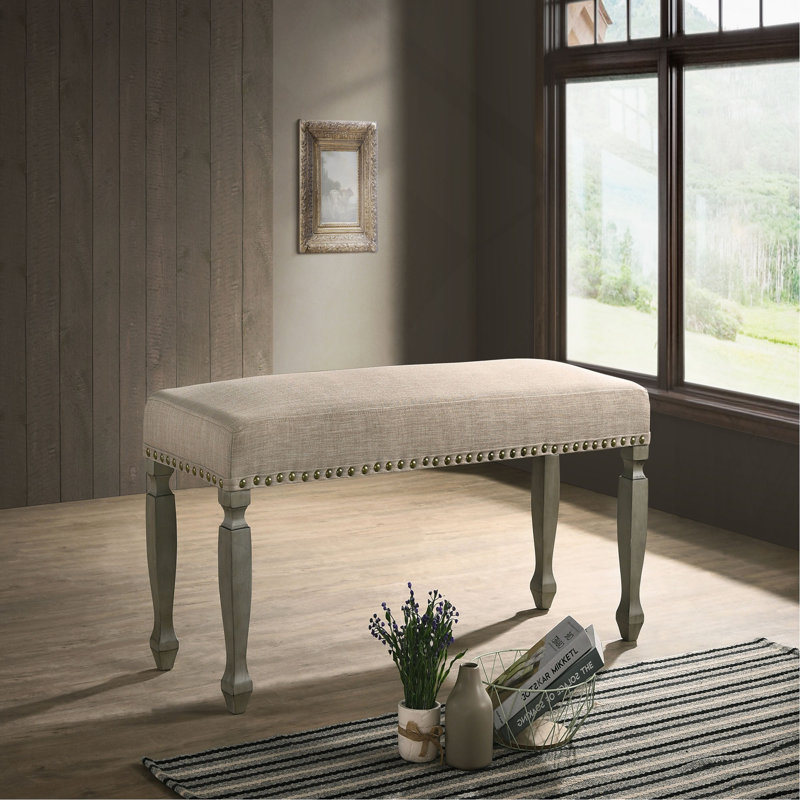 Banc rembourré à têtes de clou