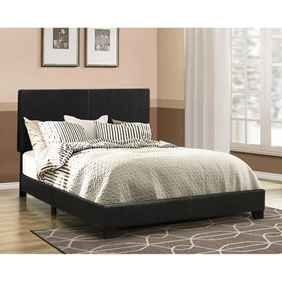 Grand lit avec un revêtement noir et un cadre élégant pour un attrait confortable de panneau de chambre à coucher rembourré
