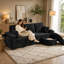 Canapé d'angle Efigenia de 239 cm avec pouf de rangement, ports USB et porte-gobelets, de couleur noir.-447516358