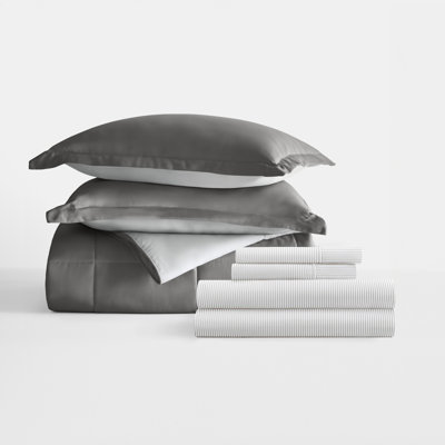 7-Piece Reversible Bedding Bundle - Solid Comforter and Patterned Sheet Set