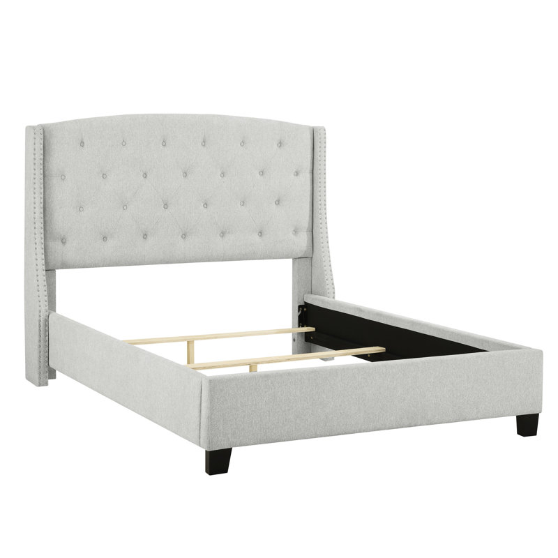 Lit double capitonné en tissu gris avec tête de lit à oreilles et tête de lit