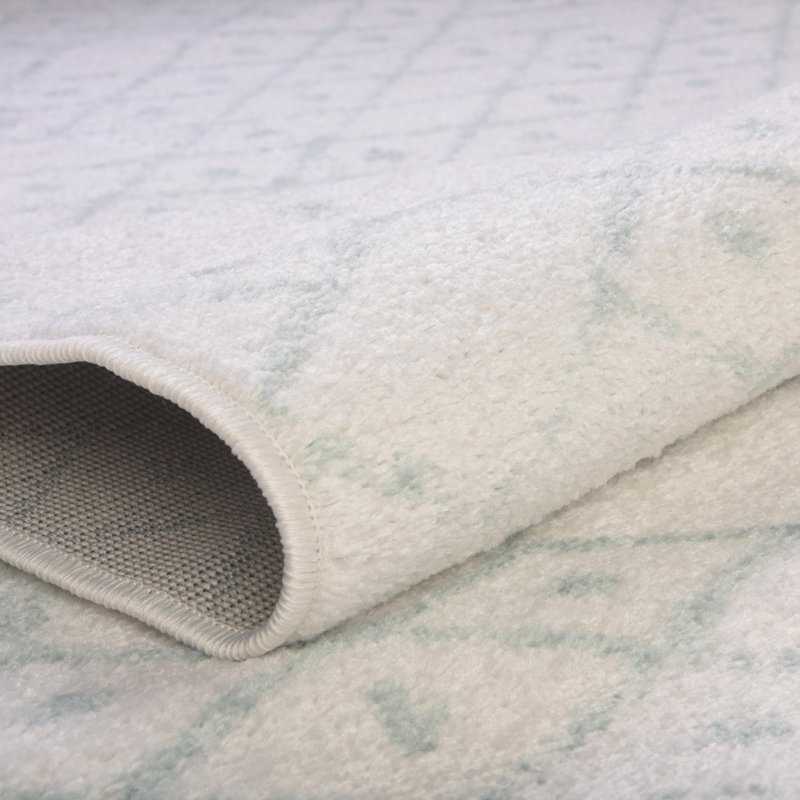Tapis ivoire à motif géométrique ivoire d'Igon, Ovale 7 pi 10 po x 10 pi