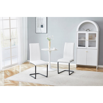 Modern High-Back PU Dining Chairs With Sturdy Metal Legs And Comfortable Upholstery For Kitchen Or Living Room Use.