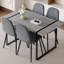 Ensemble de table et de chaises. Une table de salle à manger rectangulaire rétro minimaliste avec un dessus spécialement texturé et des pieds en métal, jumelée à des chaises douces et des pieds en métal, met en valeur un beau style de maison.-531628887