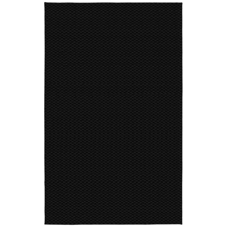 Esther Solid Color Machine Made Tufted Polypropylene Area Rug in Black